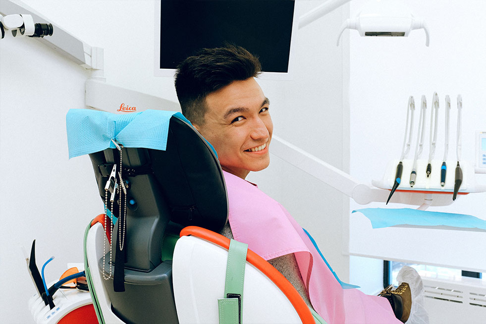 man sitting at the dental chair